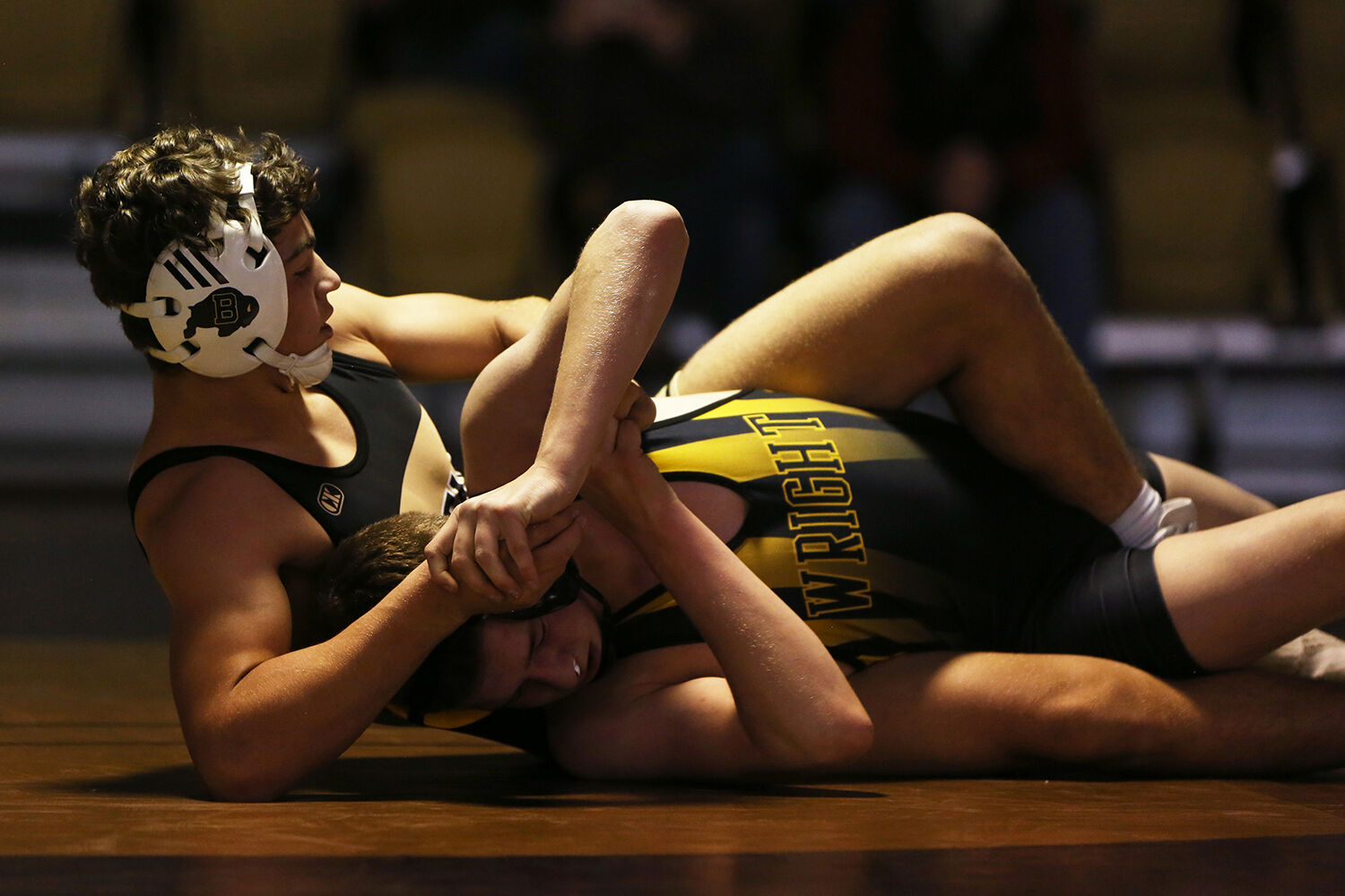 Hazen Camino pulls his Wright opponent Tadlee Isenberger in an attempt to pin him